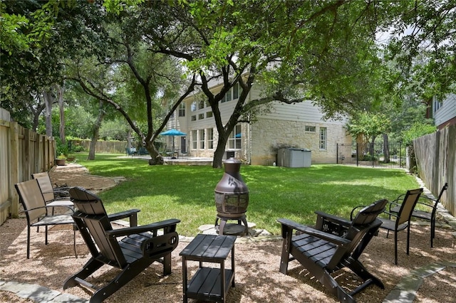 4004 Callabero Cv, Round Rock, TX 78681 - fenced backyard featuring an outdoor fire pit and a patio area