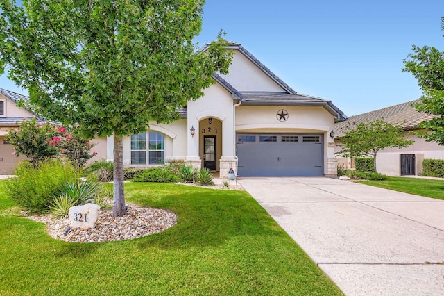 321 Cimarron Hills Trl E, Georgetown, TX 78628 - view of front of home featuring stucco siding, driveway, a front yard, and an attached garage