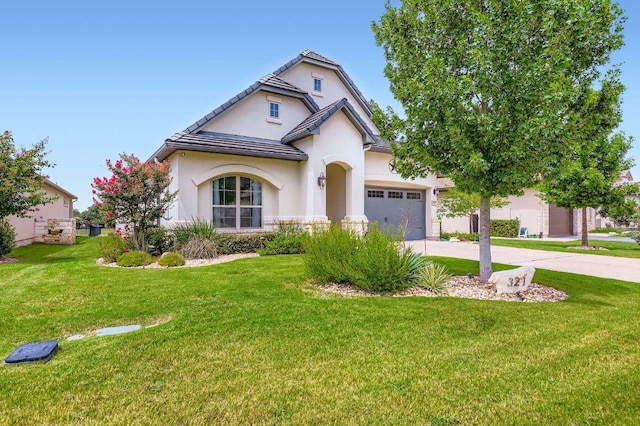 321 Cimarron Hills Trl E, Georgetown, TX 78628 - view of front of home with stucco siding, driveway, a front yard, a garage, and stone siding