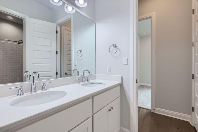 321 Cimarron Hills Trl E, Georgetown, TX 78628 - full bath with double vanity and wood finished floors