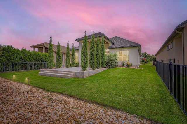 321 Cimarron Hills Trl E, Georgetown, TX 78628 - yard at dusk featuring a fenced backyard