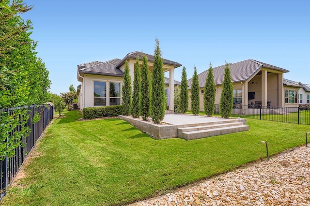 321 Cimarron Hills Trl E, Georgetown, TX 78628 - rear view of property featuring a patio, a fenced backyard, a tile roof, and stucco siding