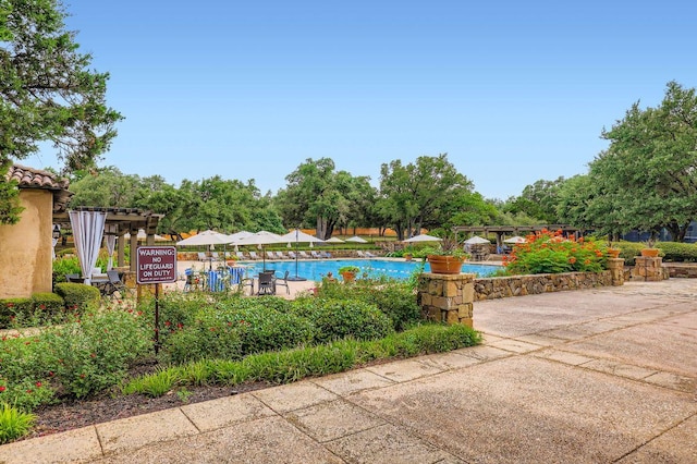 321 Cimarron Hills Trl E, Georgetown, TX 78628 - community pool featuring a pergola
