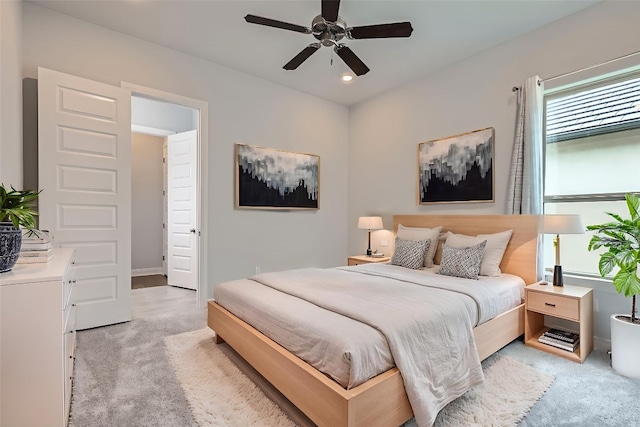 321 Cimarron Hills Trl E, Georgetown, TX 78628 - bedroom with light carpet, ceiling fan, and recessed lighting