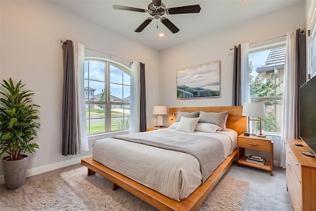 321 Cimarron Hills Trl E, Georgetown, TX 78628 - bedroom featuring multiple windows, light carpet, recessed lighting, and ceiling fan