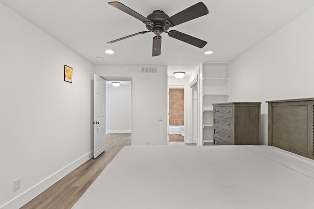 2704 San Pedro St Unit A16, Austin, TX 78705 - bedroom with wood finished floors, recessed lighting, a ceiling fan, and connected bathroom