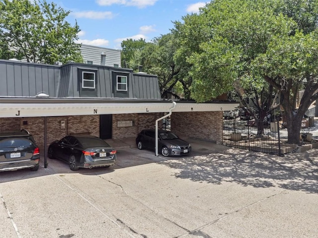 2704 San Pedro St Unit A16, Austin, TX 78705 - view of front facade with brick siding and covered parking