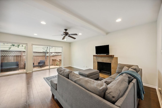 2704 San Pedro St Unit A16, Austin, TX 78705 - living room featuring a tiled fireplace, dark wood-type flooring, ceiling fan, recessed lighting, and beamed ceiling
