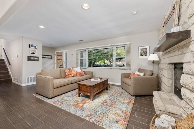 4500 Poteau Cir, Austin, TX 78734 - living room with stairway, wood finished floors, a stone fireplace, and recessed lighting