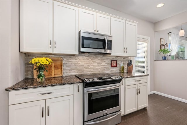 4500 Poteau Cir, Austin, TX 78734 - kitchen with appliances with stainless steel finishes, backsplash, white cabinets, dark stone countertops, and recessed lighting