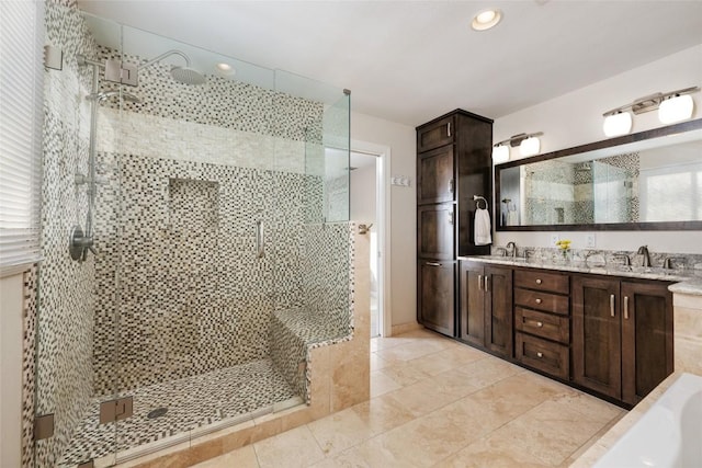 4500 Poteau Cir, Austin, TX 78734 - bathroom featuring a stall shower, double vanity, a bath, recessed lighting, and tile patterned floors