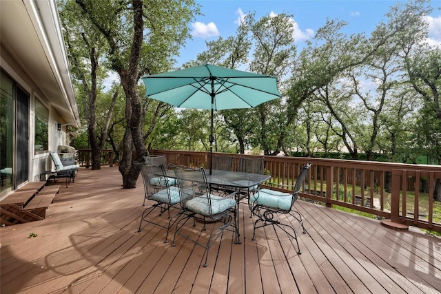 4500 Poteau Cir, Austin, TX 78734 - wooden deck with outdoor dining area and view of scattered trees