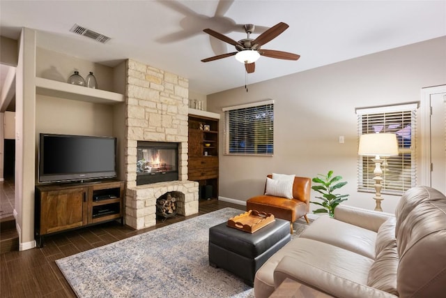 4500 Poteau Cir, Austin, TX 78734 - living area with a ceiling fan, dark wood-style floors, a fireplace, and built in shelves