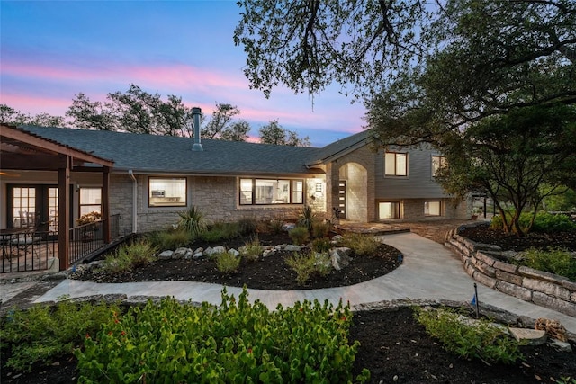 4500 Poteau Cir, Austin, TX 78734 - view of front of home featuring stone siding and a shingled roof