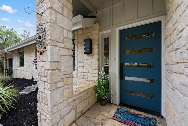 4500 Poteau Cir, Austin, TX 78734 - property entrance featuring stone siding and board and batten siding