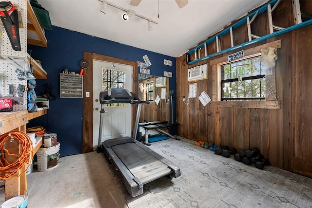 4500 Poteau Cir, Austin, TX 78734 - exercise area with healthy amount of natural light, wood walls, track lighting, and ceiling fan