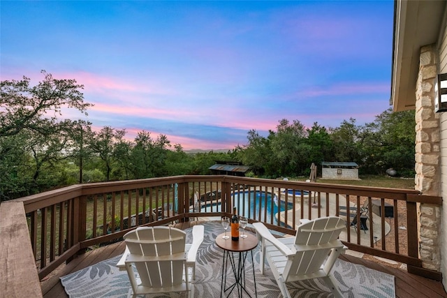 4500 Poteau Cir, Austin, TX 78734 - deck at dusk featuring an outdoor pool