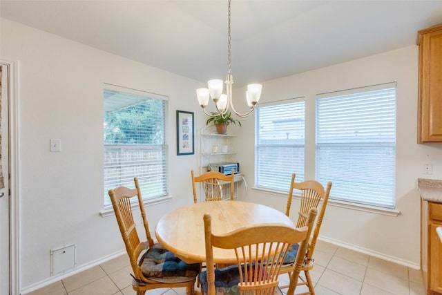 1312 Kothman Dr, Hutto, TX 78634 - dining room featuring light tile patterned floors and a chandelier