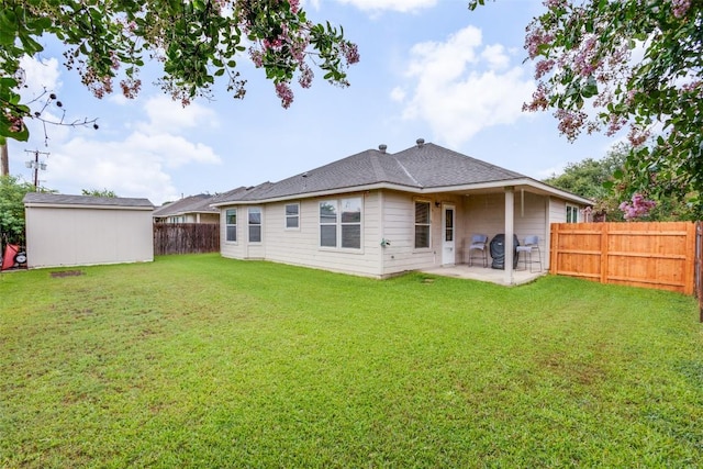 1312 Kothman Dr, Hutto, TX 78634 - rear view of property featuring a patio, a fenced backyard, and an outdoor structure