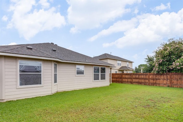 1312 Kothman Dr, Hutto, TX 78634 - back of house featuring a fenced backyard and a shingled roof
