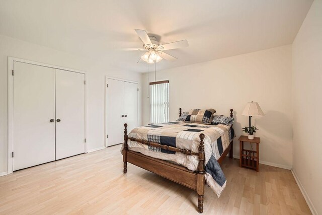 914 Hermitage Dr, Austin, TX 78753 - bedroom with two closets, light wood finished floors, and ceiling fan