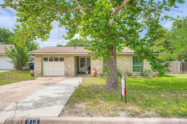914 Hermitage Dr, Austin, TX 78753 - single story home featuring stone siding, an attached garage, concrete driveway, and roof with shingles