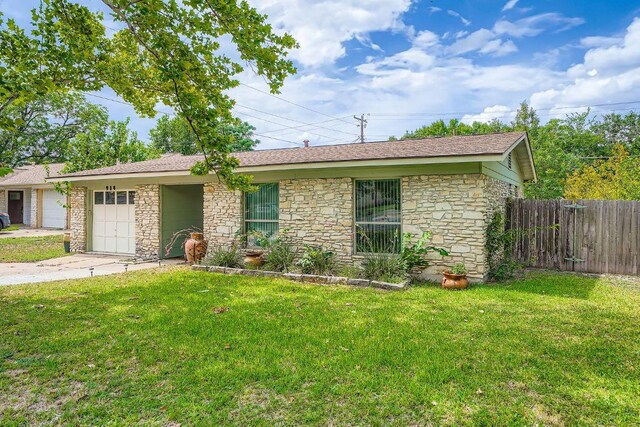 914 Hermitage Dr, Austin, TX 78753 - ranch-style house featuring stone siding and a garage