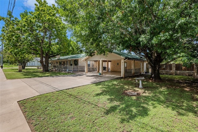 500 N Main St N, Burnet, TX 78611 - view of front of house with concrete driveway and brick siding