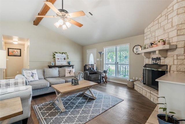 500 N Main St N, Burnet, TX 78611 - living room with a ceiling fan, dark wood-style flooring, and a stone fireplace