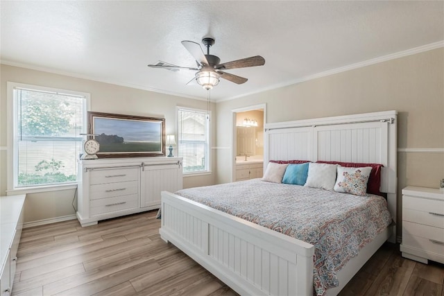 500 N Main St N, Burnet, TX 78611 - bedroom with light wood-style flooring, crown molding, ceiling fan, and ensuite bathroom