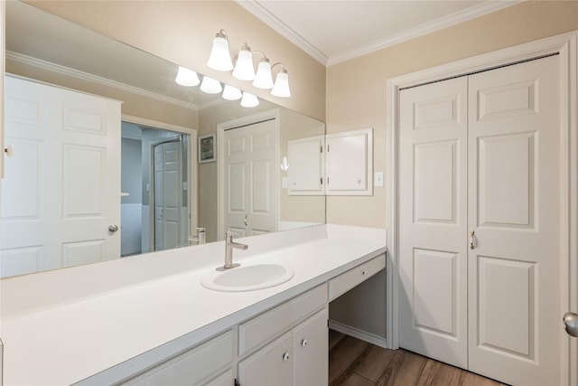 500 N Main St N, Burnet, TX 78611 - bathroom with crown molding, vanity, and wood finished floors