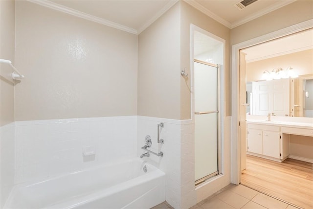 500 N Main St N, Burnet, TX 78611 - bathroom with vanity, a garden tub, a stall shower, crown molding, and tile patterned floors