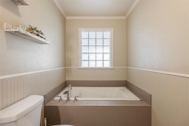 500 N Main St N, Burnet, TX 78611 - bathroom featuring a bath, ornamental molding, and a wainscoted wall