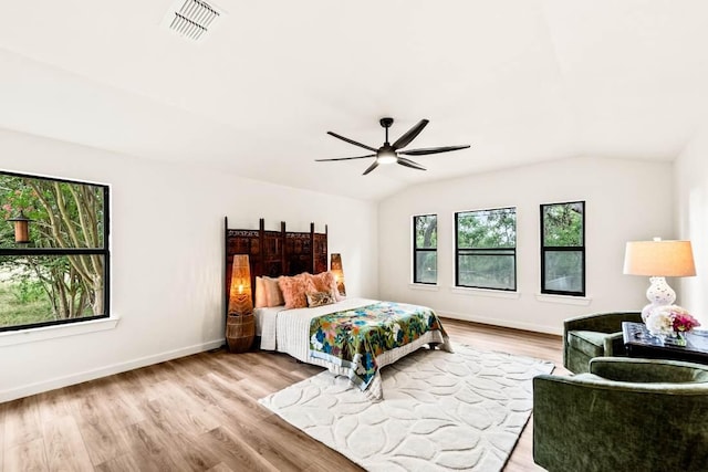 8401 Persimmon Grv, Austin, TX 78737 - bedroom with vaulted ceiling, wood finished floors, and ceiling fan