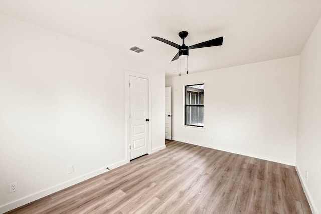 8401 Persimmon Grv, Austin, TX 78737 - spare room with light wood-type flooring and a ceiling fan