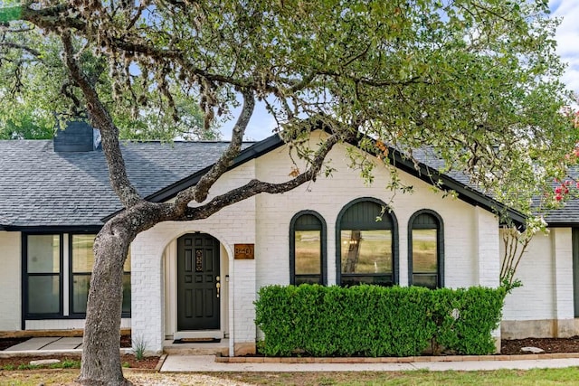 8401 Persimmon Grv, Austin, TX 78737 - view of front of house with roof with shingles and brick siding