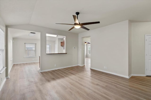 121 Brazoria Trl, San Marcos, TX 78666 - unfurnished living room with ceiling fan, light wood-style flooring, and plenty of natural light