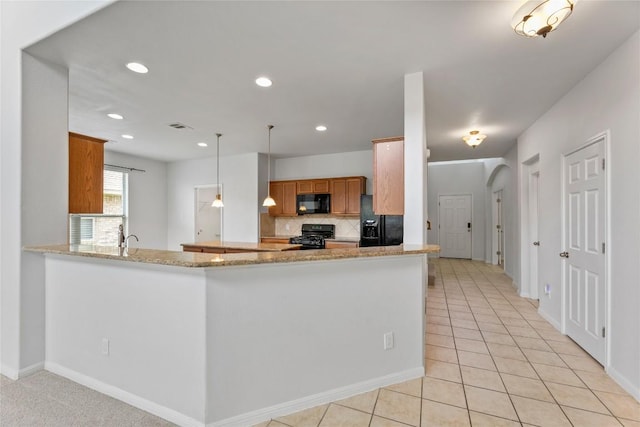 18609 Sandy Bottom Dr, Pflugerville, TX 78660 - kitchen featuring black appliances, decorative backsplash, light tile patterned floors, brown cabinets, and recessed lighting