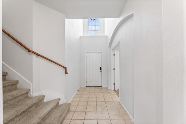 18609 Sandy Bottom Dr, Pflugerville, TX 78660 - entrance foyer with stairway and light tile patterned flooring