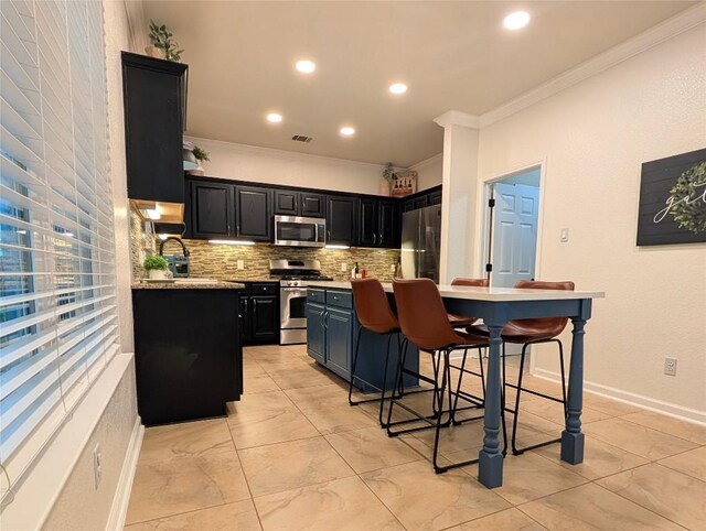 14504 Templemore Cv, Austin, TX 78717 - kitchen featuring stainless steel appliances, crown molding, dark cabinets, light countertops, and backsplash