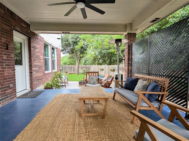 14504 Templemore Cv, Austin, TX 78717 - fenced backyard featuring a ceiling fan, a patio area, and outdoor lounge area