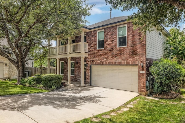 14504 Templemore Cv, Austin, TX 78717 - view of front of home featuring a balcony, brick siding, an attached garage, and concrete driveway