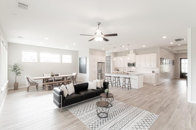 716 Dayridge Dr, Dripping Springs, TX 78620 - living area with ceiling fan, light wood-type flooring, plenty of natural light, and recessed lighting