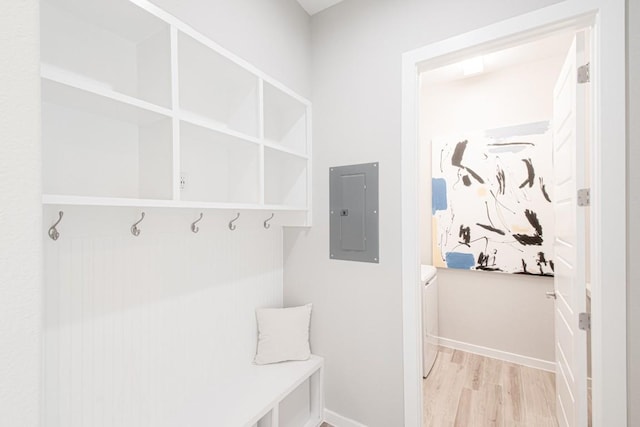 716 Dayridge Dr, Dripping Springs, TX 78620 - mudroom with electric panel, light wood-style flooring, and washing machine and dryer