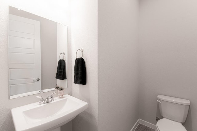 716 Dayridge Dr, Dripping Springs, TX 78620 - half bathroom featuring a sink and wood finished floors