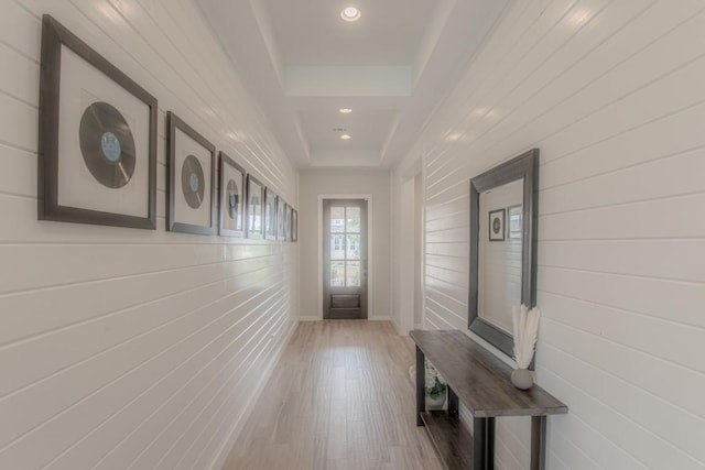 716 Dayridge Dr, Dripping Springs, TX 78620 - hallway with recessed lighting, wood finished floors, a tray ceiling, and wooden walls