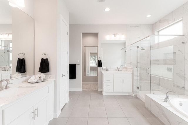 716 Dayridge Dr, Dripping Springs, TX 78620 - bathroom with two vanities, a bath, a shower stall, tile patterned floors, and recessed lighting