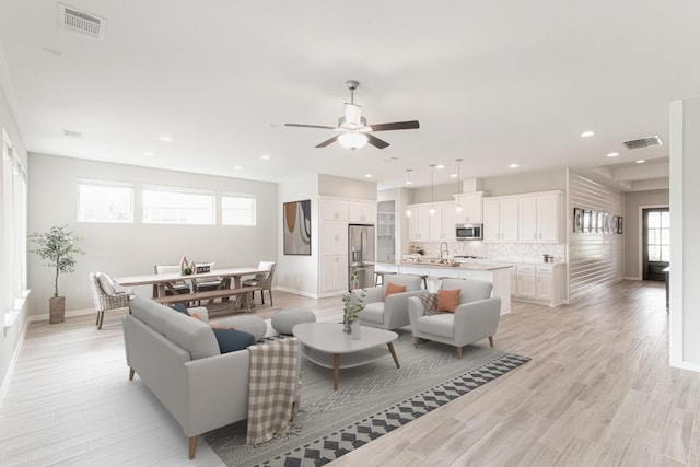716 Dayridge Dr, Dripping Springs, TX 78620 - living room with ceiling fan, healthy amount of natural light, light wood-style flooring, and recessed lighting