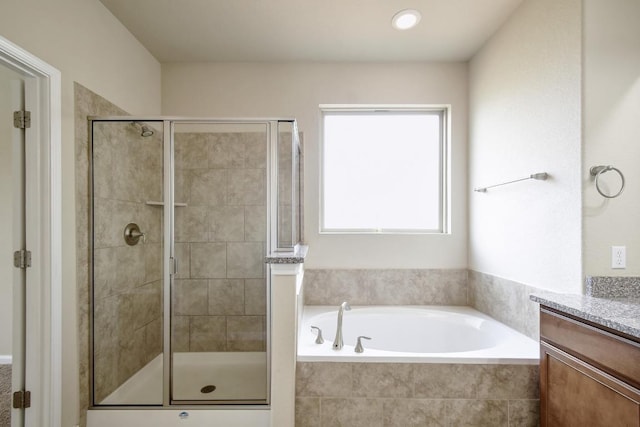 7822 Harvest Bay, San Antonio, TX 78253 - full bath featuring vanity, a garden tub, and a stall shower