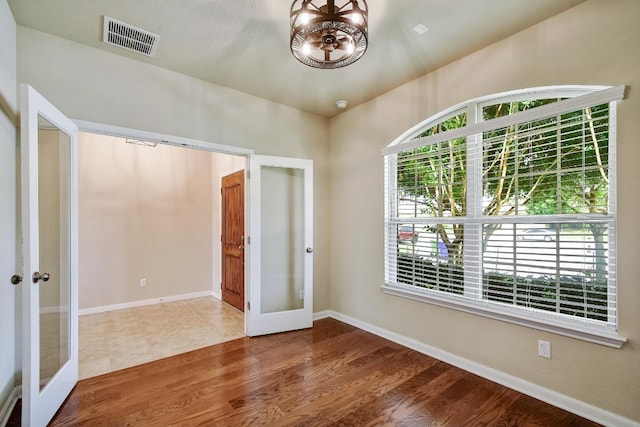 7822 Harvest Bay, San Antonio, TX 78253 - empty room with french doors and wood finished floors